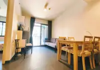 1 Bedroom Condo for Rent at Unixx South Pattaya dining table and lounge seating with balcony doors