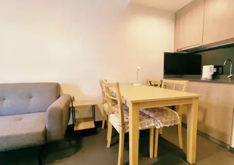 1 Bedroom Condo for Rent at Unixx South Pattaya dining area next to kitchenette with sink and kettle