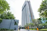 1 Bedroom Condo for Rent at Unixx South Pattaya high-rise tower exterior with security entrance gate