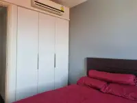 1 Bedroom Condo for Rent at Unixx South Pattaya bedroom closet with air conditioning unit above