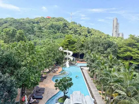 2 Bedroom Condo for Rent at Unixx South Pattaya aerial view of resort-style pool with water slide and tropical gardens