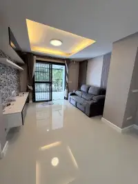 4 Bedroom House for Rent in East Pattaya living room with gray sofa and balcony access