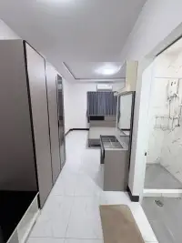 4 Bedroom House for Rent in East Pattaya hallway with wardrobes leading to en-suite bathroom