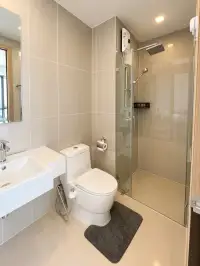 2 Bedroom Condo for Sale at Pattaya Posh bathroom with glass-enclosed shower and modern fixtures