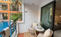 1 Bedroom Condo for Rent at Venetian Signature Condo Resort private balcony seating overlooking swimming pool