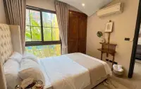 1 Bedroom Condo for Rent at Venetian Signature Condo Resort cozy bedroom with pool view and wooden wardrobe