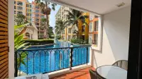 1 Bedroom Condo for Rent at Venetian Signature Condo Resort balcony view of lagoon pool and resort buildings