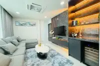 5 Bedroom House for Rent at View Point Village cozy living room with wine cooler and marble TV wall