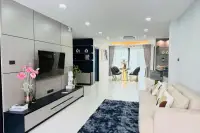 5 Bedroom House for Rent at View Point Village open-plan living room with TV wall and dining area