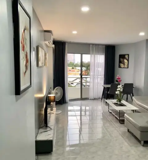 1 Bedroom Condo for Rent at View Talay 1 open living area with city skyline view through balcony doors