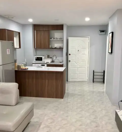 1 Bedroom Condo for Rent at View Talay 1 entryway with wooden kitchenette and front door