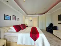 2 Bedroom Condo for Sale at View Talay 3A master bedroom with white bedding and red accent pillows