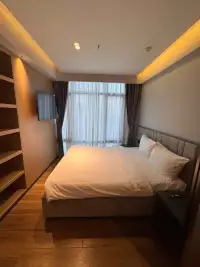 Studio Condo for Sale at View Talay 5D cozy bedroom interior with built-in shelving and TV