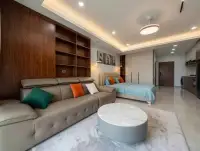 Studio Condo for Sale & Rent at View Talay 5D open-plan layout with wood shelving, sofa, and bed