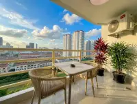 Studio Condo for Sale & Rent at View Talay 5D balcony with seating and panoramic Pattaya skyline view
