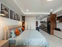 Studio Condo for Sale & Rent at View Talay 5D bedroom with wardrobe, artwork, and kitchenette view