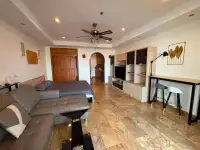 Studio Condo for Sale at View Talay 5D open layout with sofa, bed, TV unit, and breakfast bar
