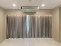 1 Bedroom Condo for Sale at View Talay 6 living room with floor-to-ceiling curtains and ceiling-mounted air conditioner