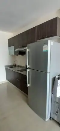 1 Bedroom Condo for Sale at View Talay 6 kitchen with stainless steel refrigerator and granite counters