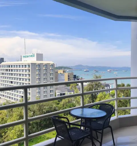 Studio Condo for Sale at View Talay 6 balcony with seating overlooking Pattaya Bay and coastline