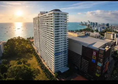 Studio Condo for Sale at View Talay 6 high-rise tower exterior view at sunset near the beach