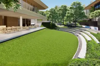Solava Pattaya landscaped garden with curved stone amphitheatre steps lush green lawn and outdoor dining terrace