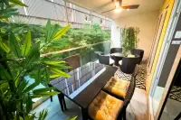 1 Bedroom Condo for Rent at VN Residence 3 private balcony with rattan seating and lush plants