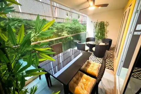 1 Bedroom Condo for Rent at VN Residence 3 private balcony with rattan seating and lush plants