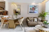 1 Bedroom Condo for Sale at The Riviera Malibu open-plan living and dining area with chandelier and sofa.