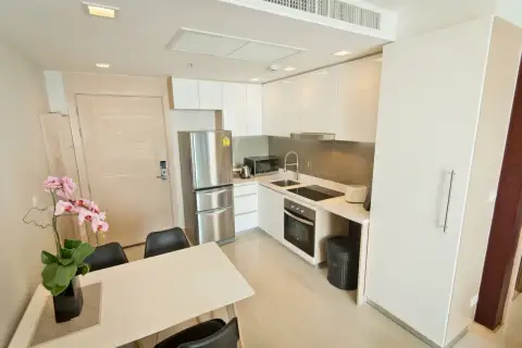 1 Bedroom Condo for Sale & Rent at Palm Wongamat modern kitchen with stainless steel appliances