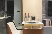 Studio Condo for Sale at Pristine Park 3 dining area with small table, two chairs, and wine bottles.