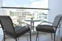 1 Bedroom Condo for Sale at Water Park private balcony with table, chairs, and city skyline view