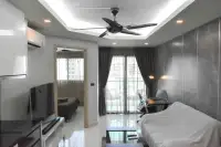 1 Bedroom Condo for Sale at Water Park open living area with ceiling fan, TV, and balcony access