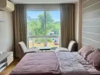 1 Bedroom Condo for Sale at Whale Marina bedroom with double bed and large window facing the marina