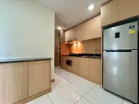 2 Bedroom Condo for Sale at Whale Marina modern kitchen with wood cabinetry and stainless steel refrigerator