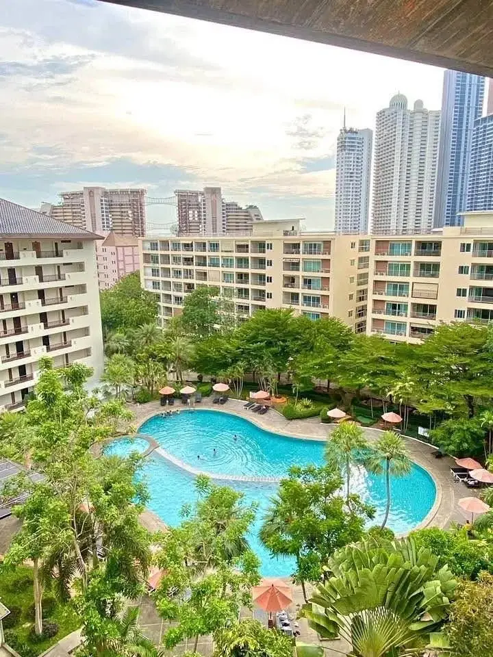1 Bedroom Condo for Sale at Wongamat Privacy balcony view of lagoon pool and Pattaya skyline