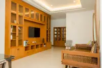 6 Bedroom House for Sale & Rent at Amorn Village, living room with large wooden entertainment unit and sofa.