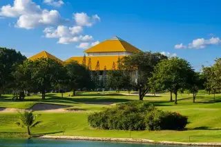 Greenview Villa Phoenix Golf Club Pattaya large cream house with red tile roof, private swimming pool, and lounge chairs.