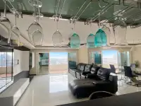 2 Bedroom Condo for Sale at PKCP Tower living room with hanging wine glasses and city skyline view