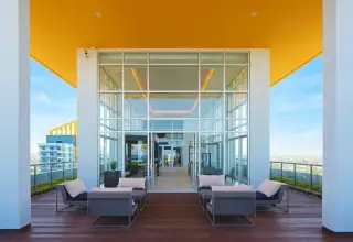 Lumpini Park Beach Jomtien rooftop terrace lounge seating with city view under yellow canopy