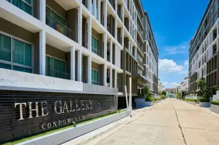 The Gallery Condominium, aerial view of modern buildings with rooftop swimming pools, lounge areas, and distant ocean.