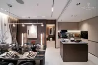 2 Bedroom Condo for Sale at Panora Estuaria modern dining area with black marble table and open-plan kitchen.