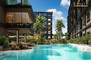 Zenith Pattaya aerial view of modern condo complex with multiple pools, lush rooftop gardens, and palm trees.