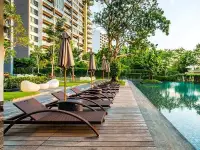 1 Bedroom Condo for Sale at Zire Wongamat outdoor swimming pool with wooden deck sun loungers and garden