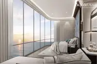 3 Bedroom Condo for Sale at Aquarous Jomtien Pattaya master bedroom with floor-to-ceiling windows and panoramic ocean sunset view
