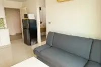 1 Bedroom Condo for Sale at Amazon Residence hallway with black refrigerator, microwave, and bathroom entrance