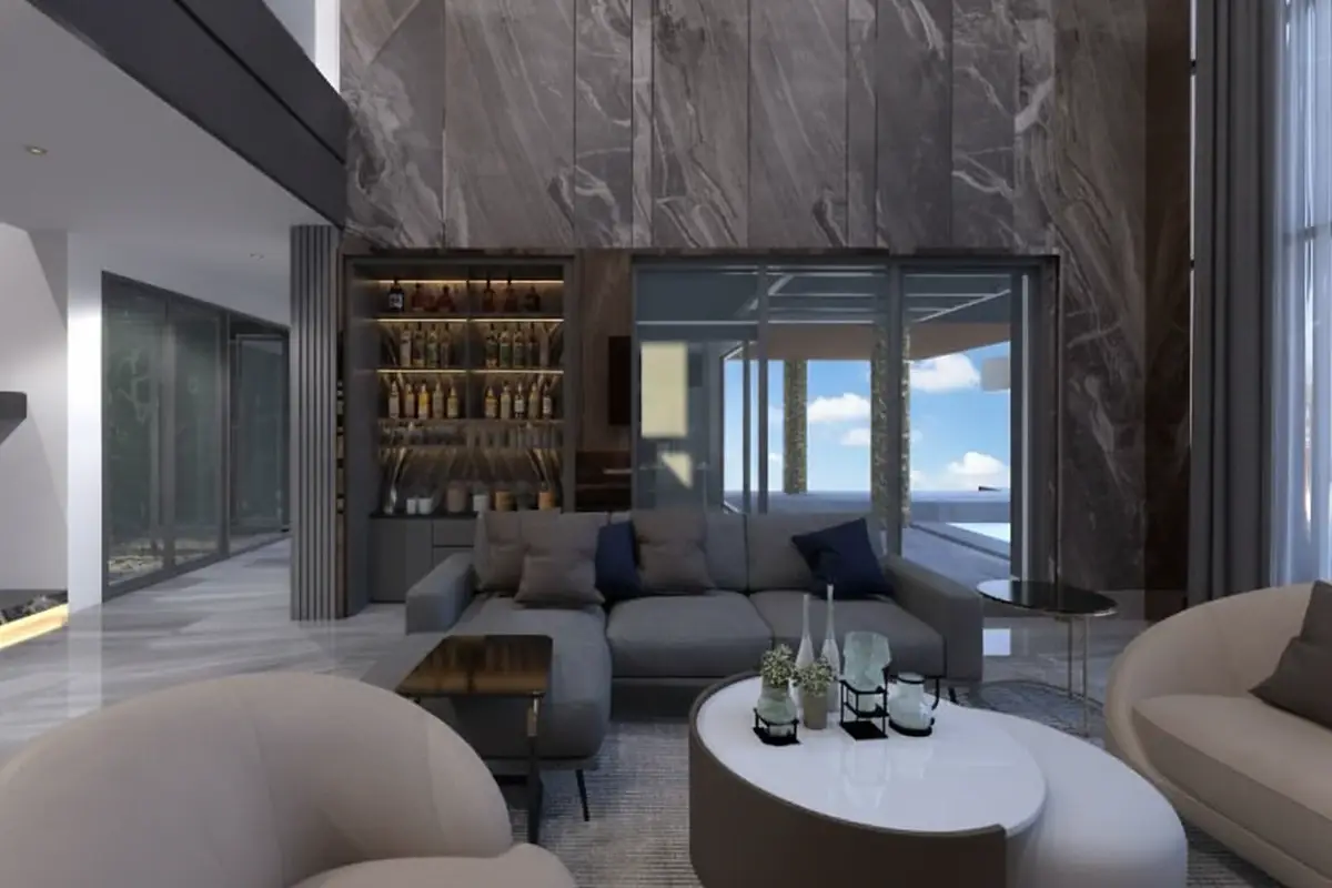 Alicera Ville elegant living area with a grey sectional sofa, built-in bar, and view of an outdoor pool.