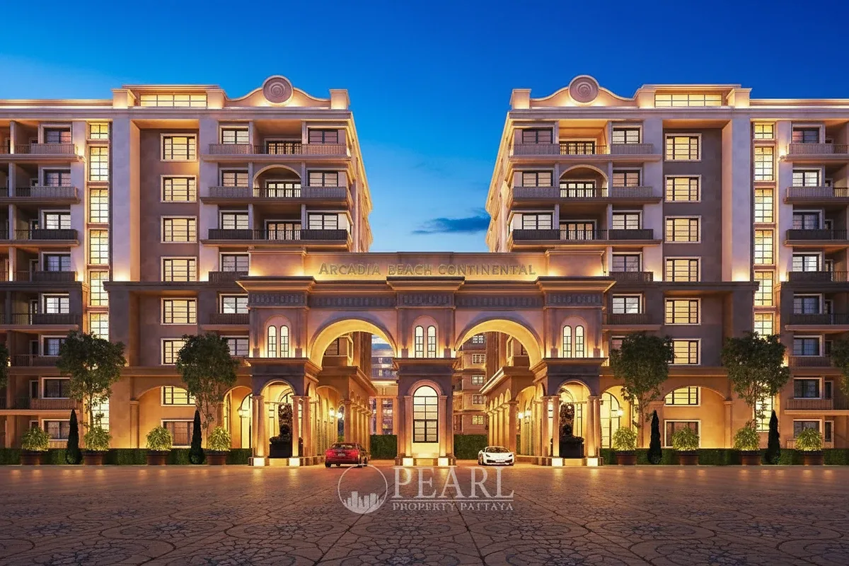 Arcadia Beach Continental: Grand facade entrance at dusk, illuminated with warm lights and classic architecture.