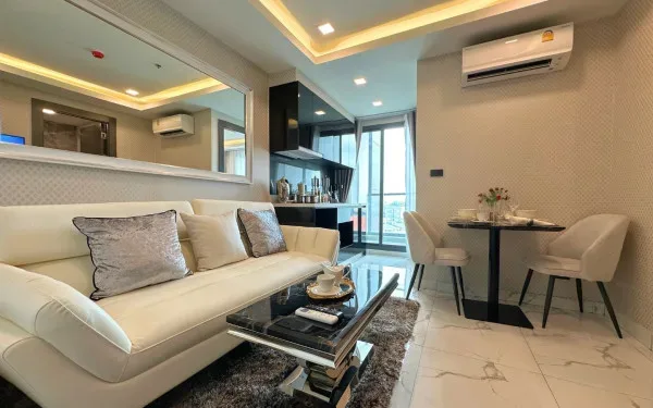 1 Bedroom Condo for Sale in Arcadia Millennium Tower living room with sofa and TV