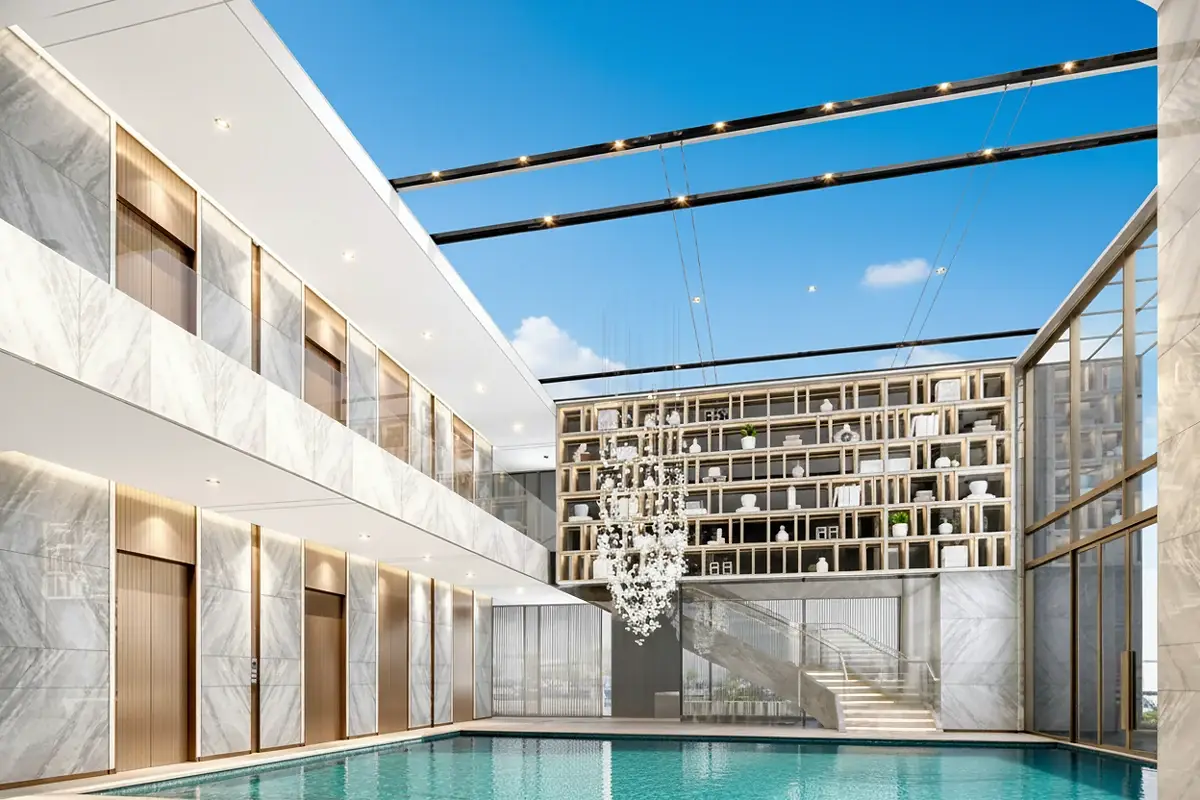 Beverly Mountain Bay Pattaya grand lobby with high ceilings, marble floors, a decorative chandelier, and a large bookshelf.